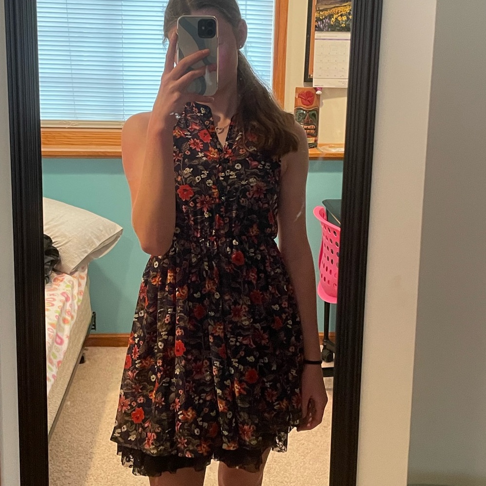 Flower dress. Blue tank top underneath.